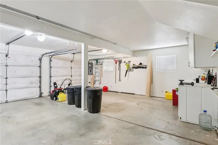 Oversized 2-car garage with workshop space and storage