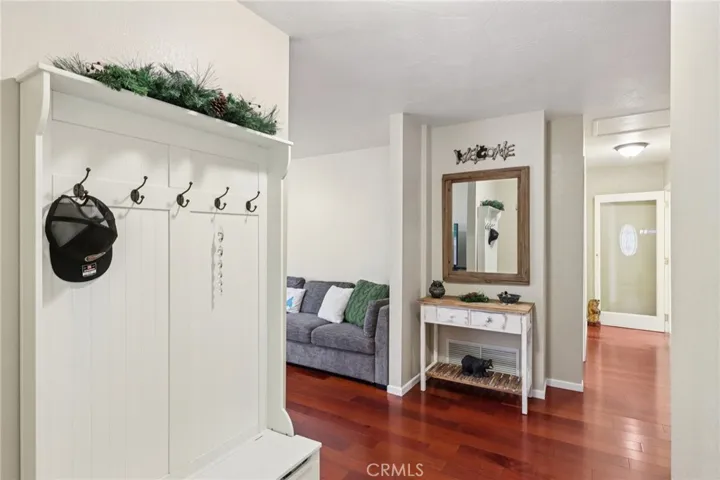 Thoughtful entry hall with drop zone and seating bench - a practical mountain landing.