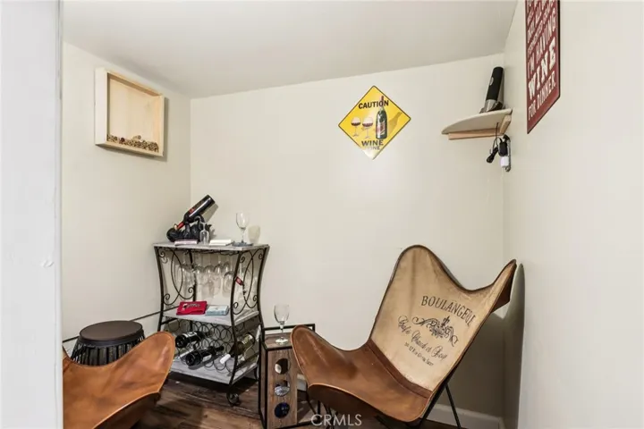 Hidden speakeasy-style wine nook off the bonus room—cheers to cozy nights.