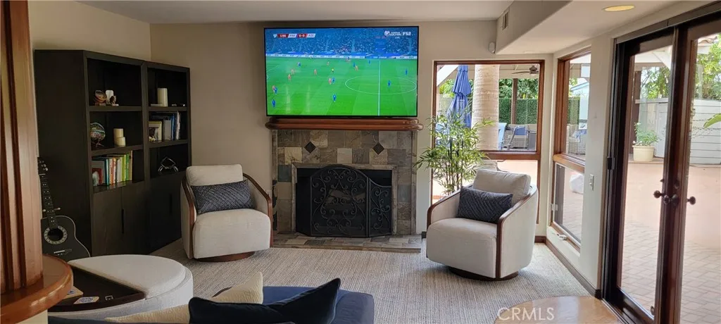 Spacious Family Room with 75" Smart TV, Fireplace, Queen Sleeper, French Doors