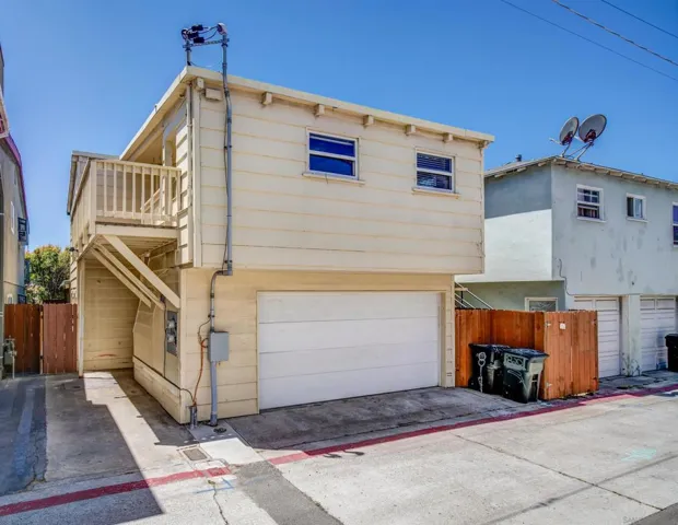 rear alley view. 818 parking space on the left of the garage