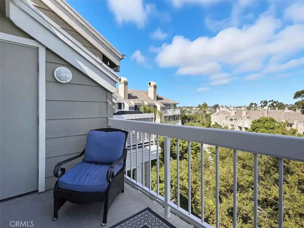 West-facing penthouse balcony offering sweeping views of Huntington Beach, capturing the vibrant energy of the coast.