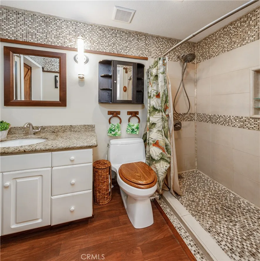 Custom Tommy Bahama-inspired bathroom featuring a spacious walk-in shower and stylish, resort-like finishes.