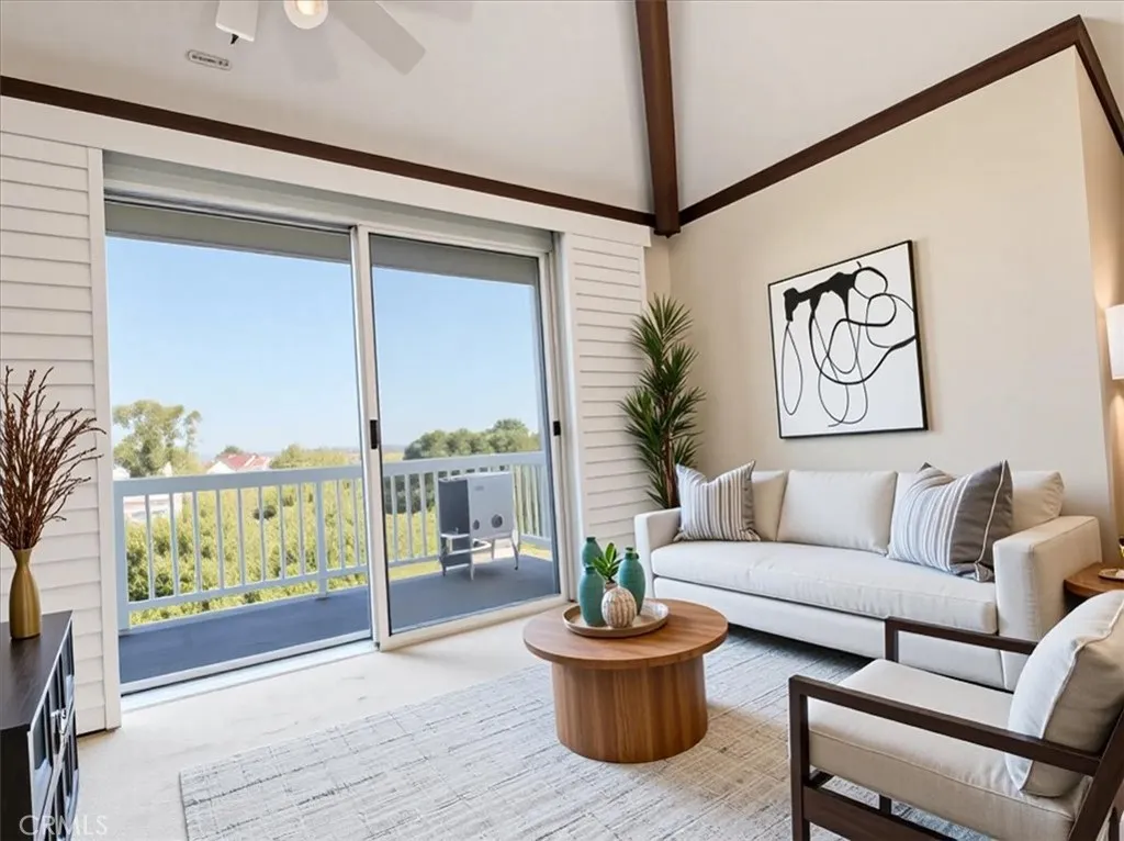 Virtually staged and beautifully lit, this living area opens to endless north-facing views for miles—inviting & airy.