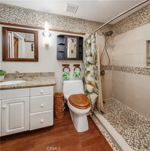 Custom Tommy Bahama-inspired bathroom featuring a spacious walk-in shower and stylish, resort-like finishes.
