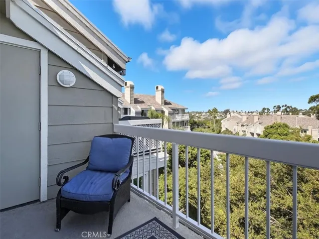 West-facing penthouse balcony offering sweeping views of Huntington Beach, capturing the vibrant energy of the coast.