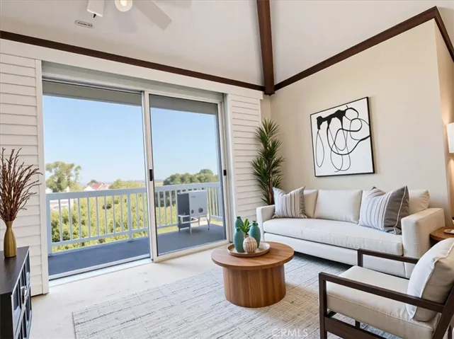 Virtually staged and beautifully lit, this living area opens to endless north-facing views for miles—inviting & airy.