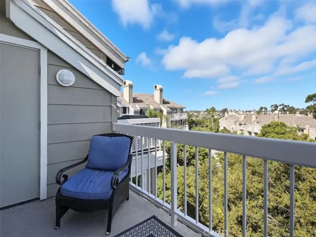 West-facing penthouse balcony offering sweeping views of Huntington Beach, capturing the vibrant energy of the coast.