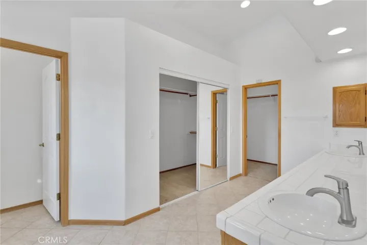 Dual closets in main bathroom