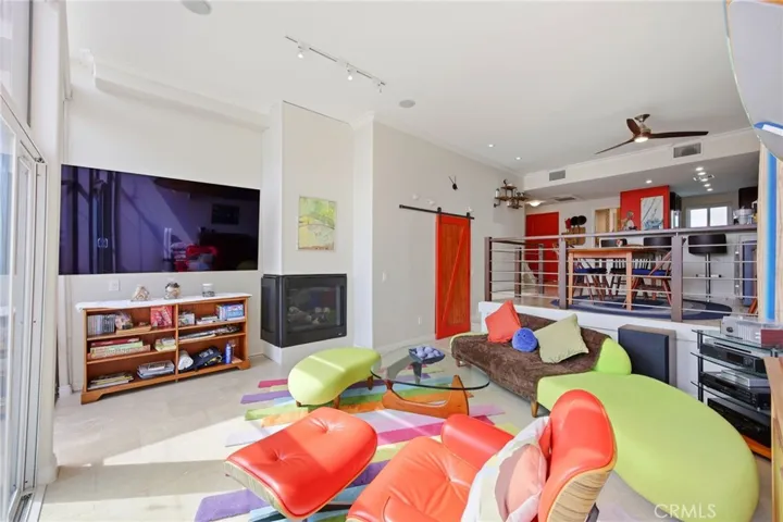 Spacious living room with wall to wall floor to ceiling windows, gas fireplace and a private balcony overlooking the picturesque marina!