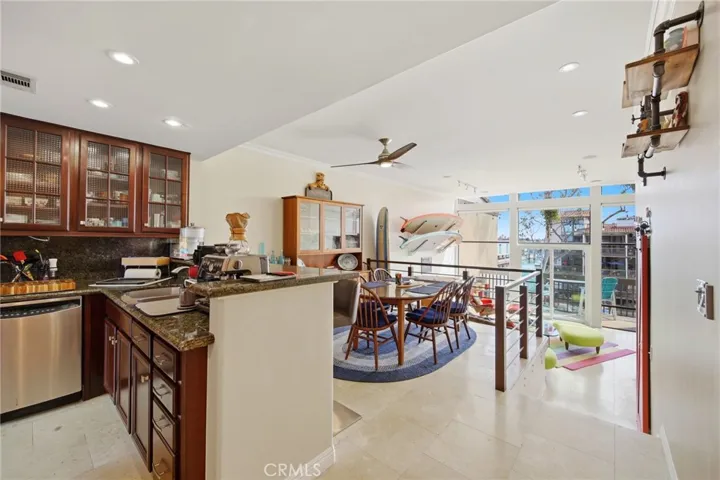 Beautifully remodeled gourmet kitchen with custom cabinets and exquisite marble counters!