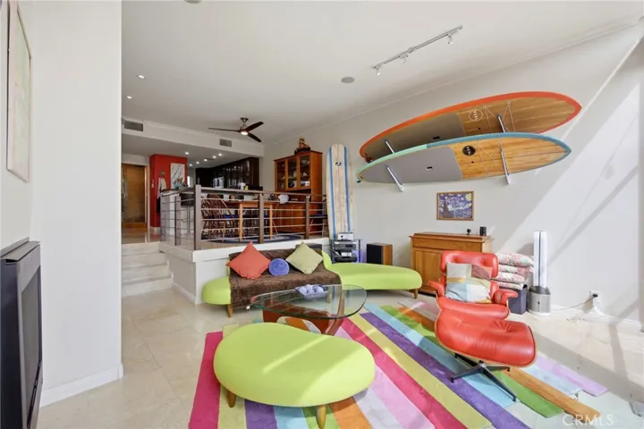 Light & bright living room with floor to ceiling wall to wall windows!