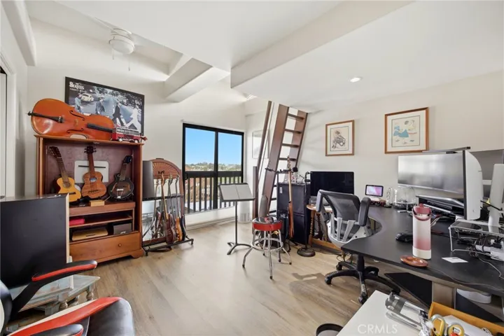 Second bedroom with a view of the back bay, ensuite bath & additional loft area!