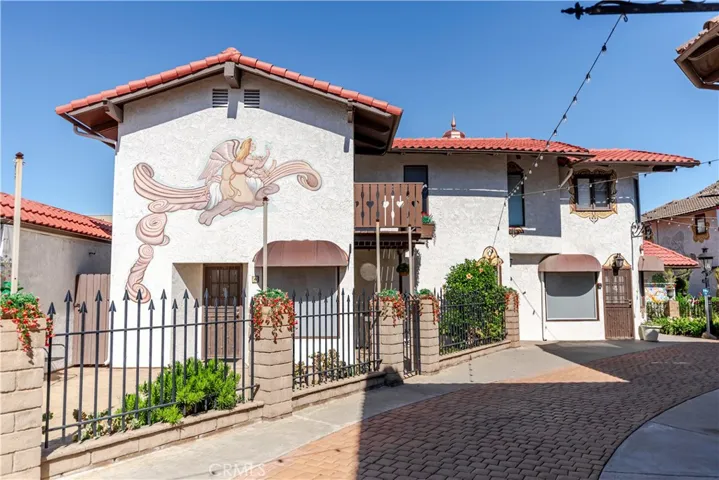 Rare freestanding live/work home in Old World Village! Huge structure!
