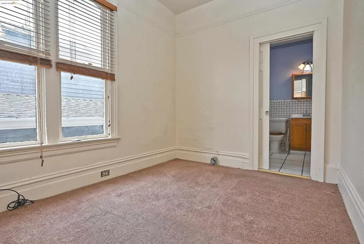 Spare room featuring light carpet
