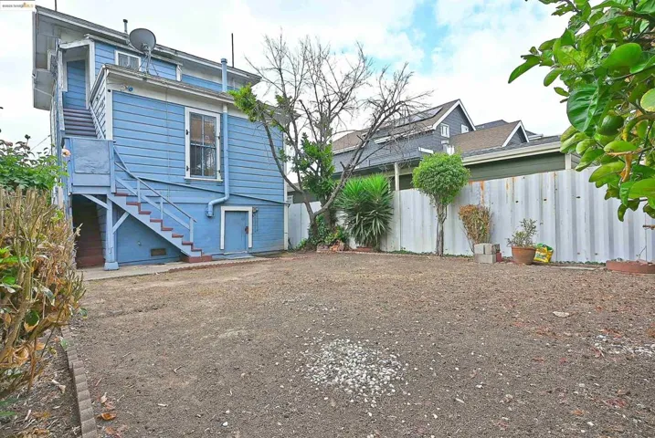Back of property featuring stairway