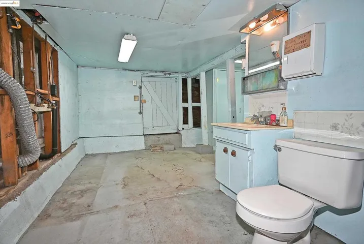 Bathroom with concrete floors and vanity