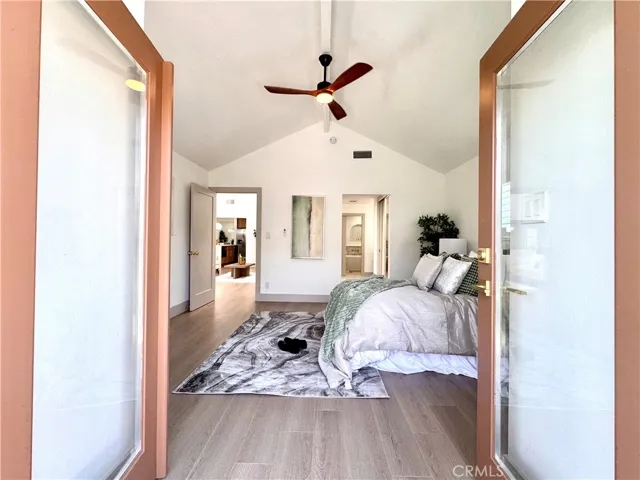 French doors off the Primary directly to patio space and the hot tub.
