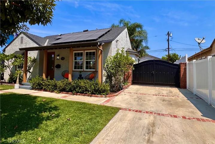 Long Drive capable of RV parking, with wrought iron privacy gate.