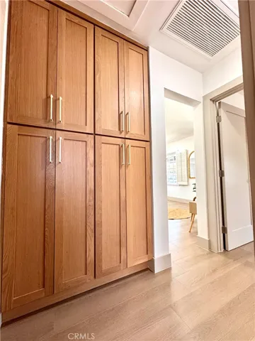 Front Hallway, with additional cabinetry for linens and storage