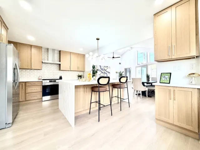Warm cabinets and Luxury vinyl plank flooring make this kitchen perfect for cocktails, wine tasting, taco tuesday parties...