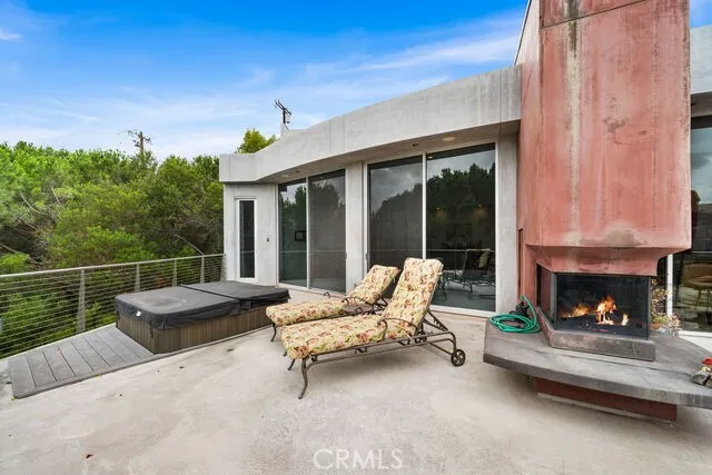 End of deck has outdoor fireplace