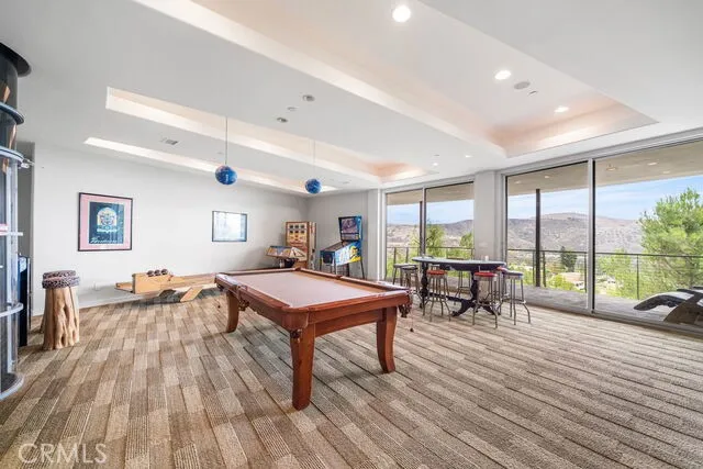 Downstairs game room with stairs and elevator access and amazing views and full length balcony