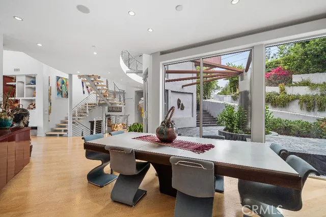 Formal dining room adjacent to entry with walls of glass
