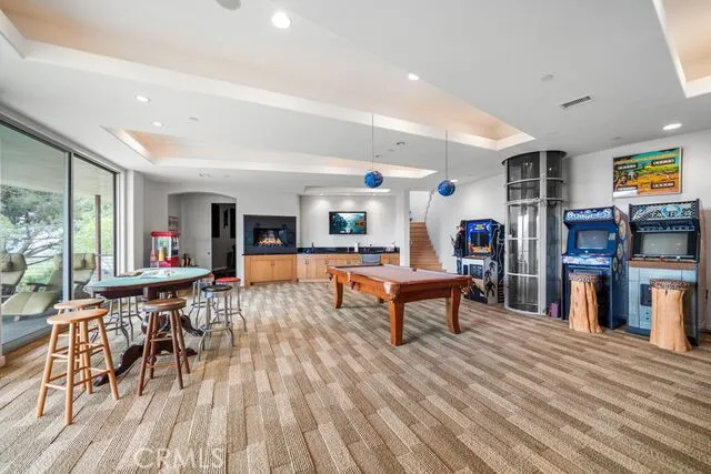 Oversized game room can accomodate additional bedrooms.  Also has a wetbar area and entry to theater room