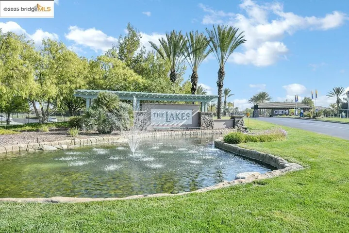 Community / neighborhood sign with a lawn