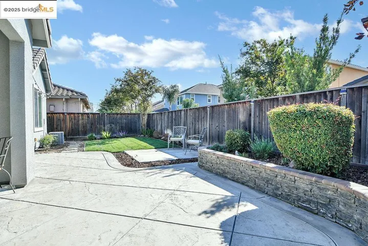 Fenced backyard featuring a patio area