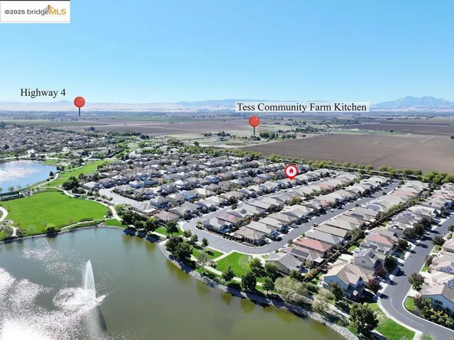 View of property location with nearby suburban area and a water and mountain view