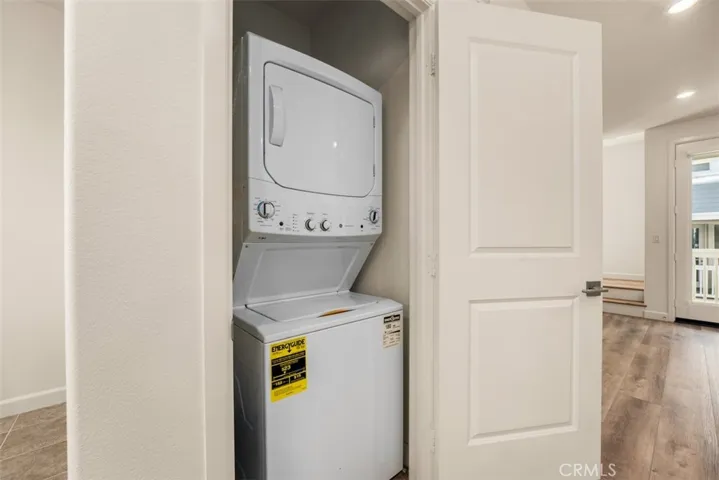 Stacked washer/dryer inside a clost