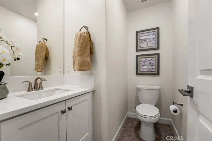 Powder room on the second level near kitchen and living room