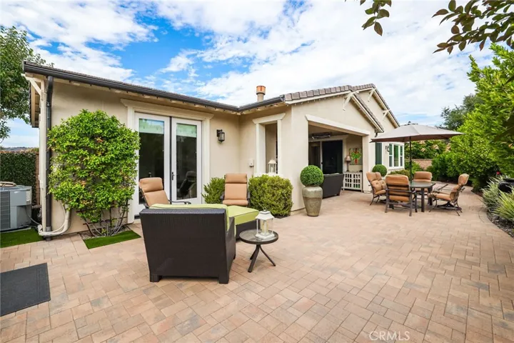 Patio area with garden views and space for outdoor lounging.