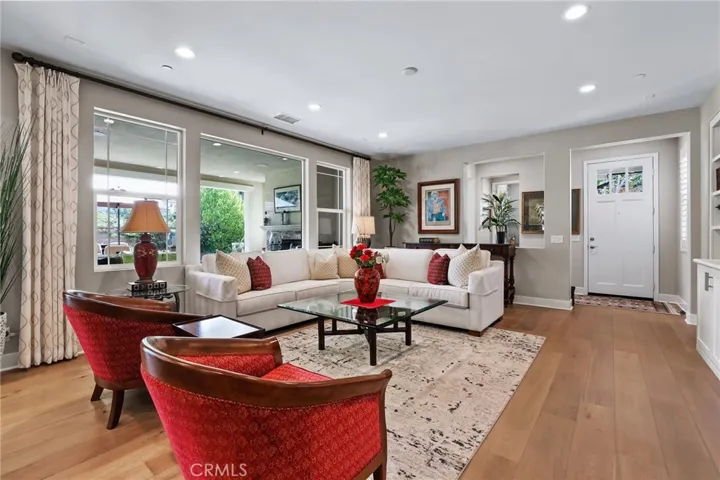 Bright and airy living room with stylish furnishings and hardwood floors.
