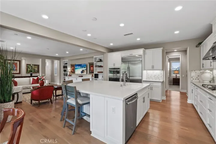 Bright kitchen with an island and ample counter space, perfect for cooking and entertaining.