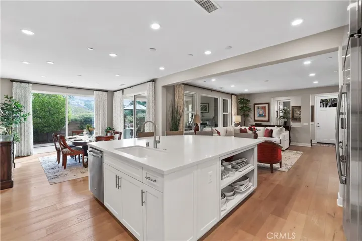 Spacious and modern kitchen with an open layout and hardwood floors.