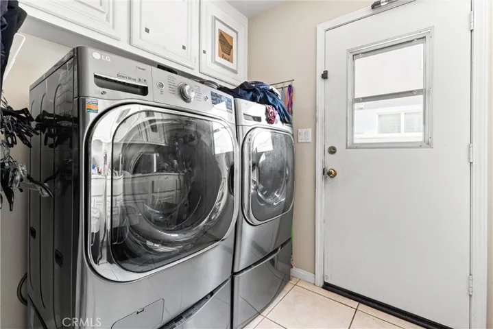 Downstairs laundry room with access to the back yard.