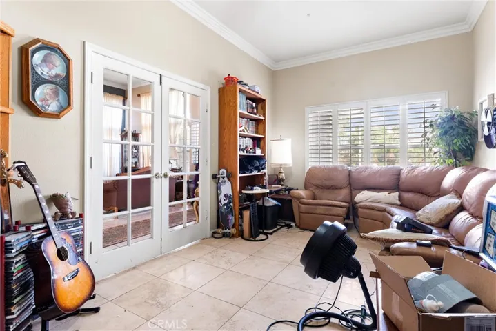Downstairs office with access to the front entry...this was previously the 4th car garage...seller's purchased the home with this addition in place!