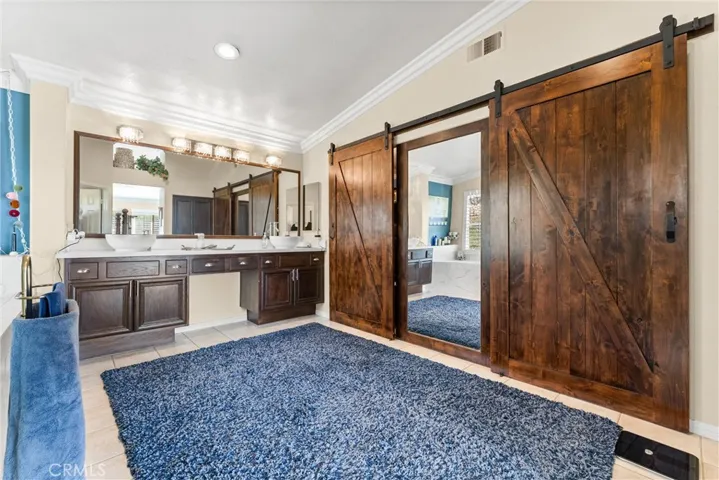 Large walk-in closet with custom barn doors!