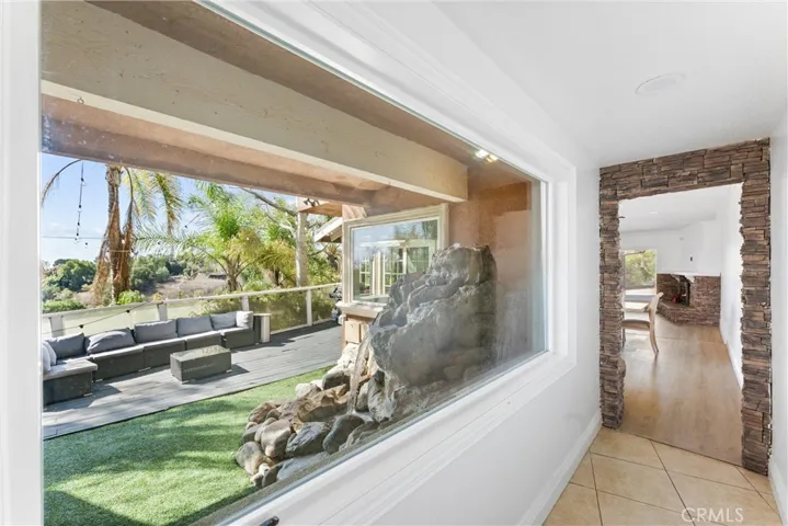 outdoor patio with waterfall and views