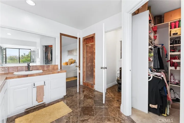 Primary bathroom with walk in closet