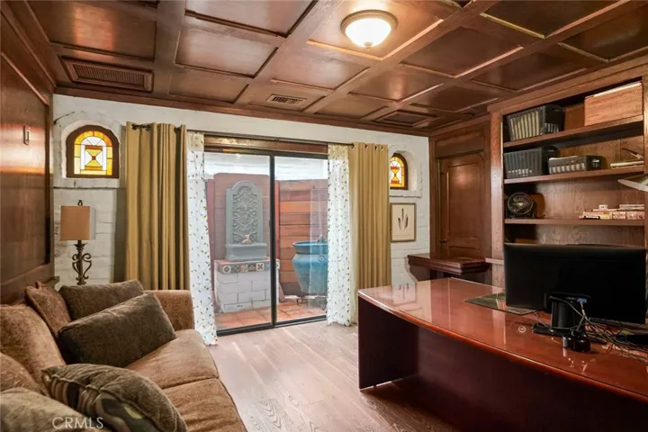 Bedroom #2 is finished as an executive office with gorgeous wood work and cabinetry.  Access to the central atrium.