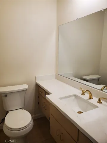 Guest bath with new quartz counter and toilet