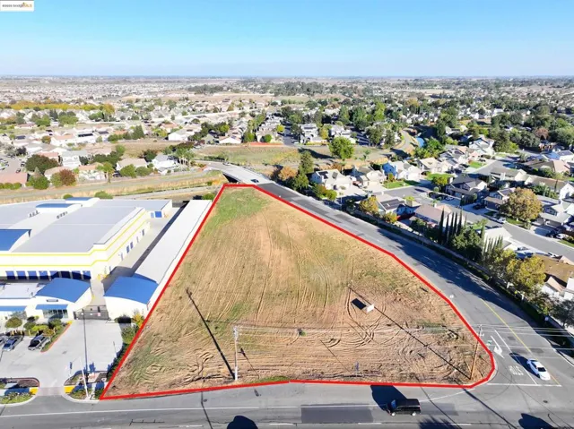Aerial perspective of suburban area featuring property boundaries highlighted