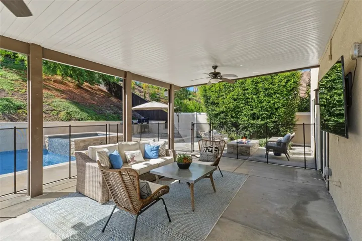 Patio Cover, enclosed fencing that is removable (2025), w/ two sets of french doors leading to backyard.