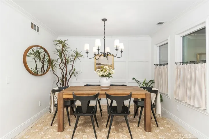 Nook/Dining w/ wall paneling and diner​​‌​​​​‌​​‌‌​​‌​​​‌‌​​​‌​​‌‌​​‌‌​​‌‌​​​​ curtains.