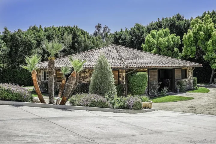 This gorgeous stone-clad stallion sized stall  main barn, can house your champion horses