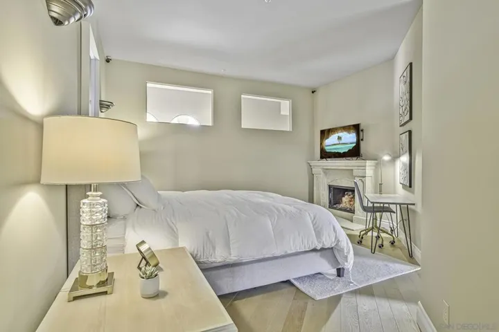Large bedroom in guest casita has its own fireplace.